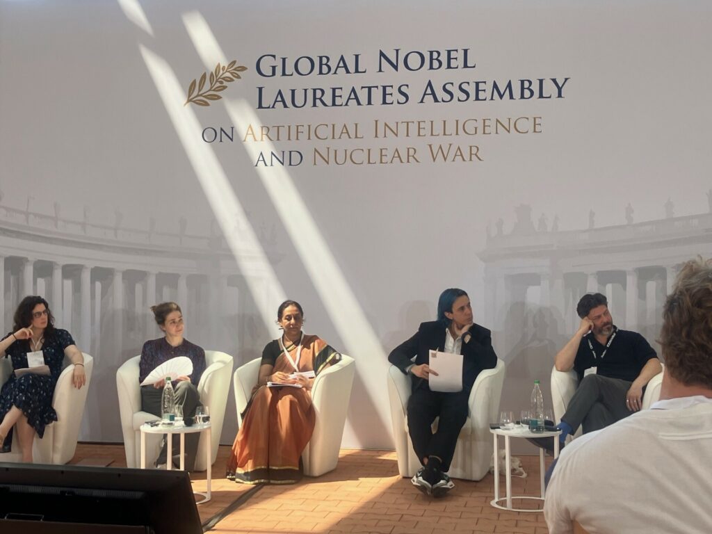 Manpreet Sethi seated on a panel at the Global Nobel Laureates Assembly on Artificial Intelligence and Nuclear War
